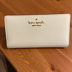 Kate Spade ♠️ - mint green wallet with 12 card slots and one window slot.